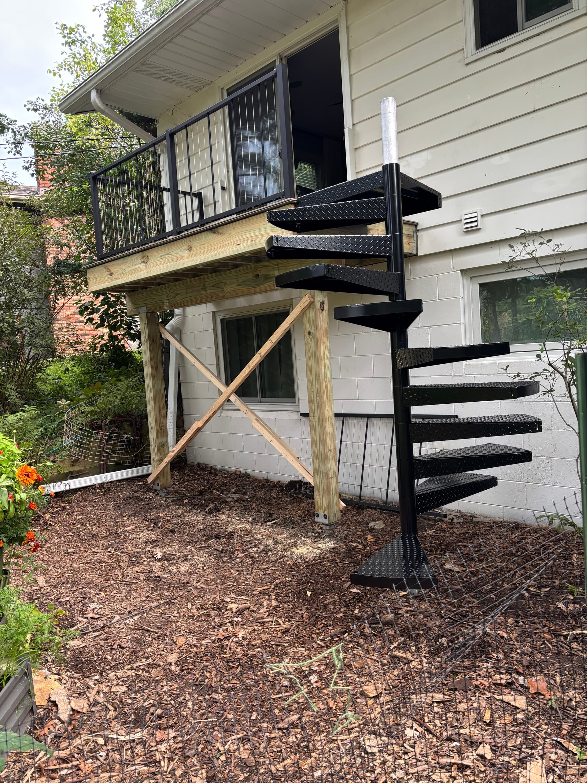 Beautiful spiral staircase addition showcasing creative home expansion solutions
